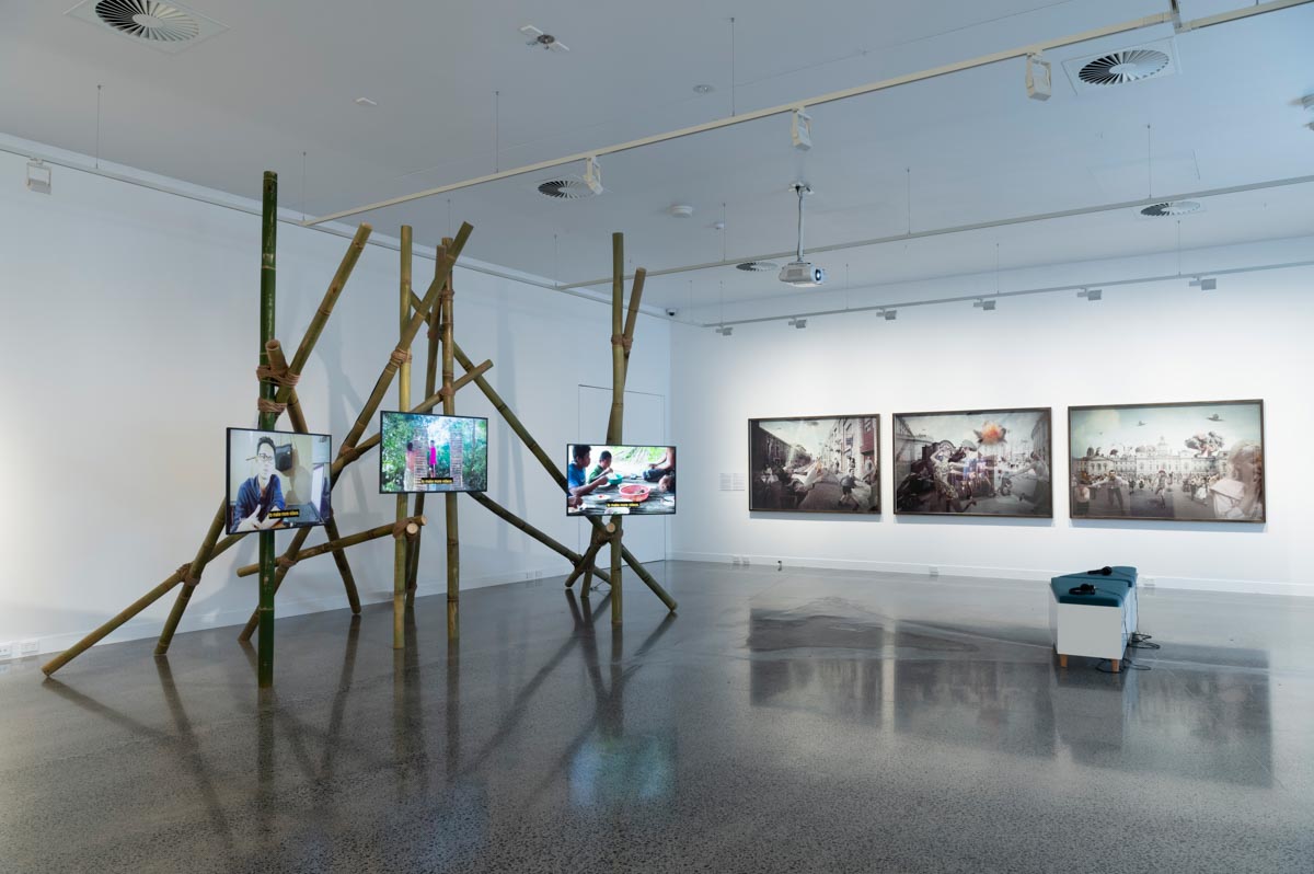 Installation view: ‘Picturing the End’. In view: Tiyan Baker, ‘Bamboo Paradise’, 2019; Michael Cook, ‘Invasion’ series, 2017. Photo: Natasha Harth