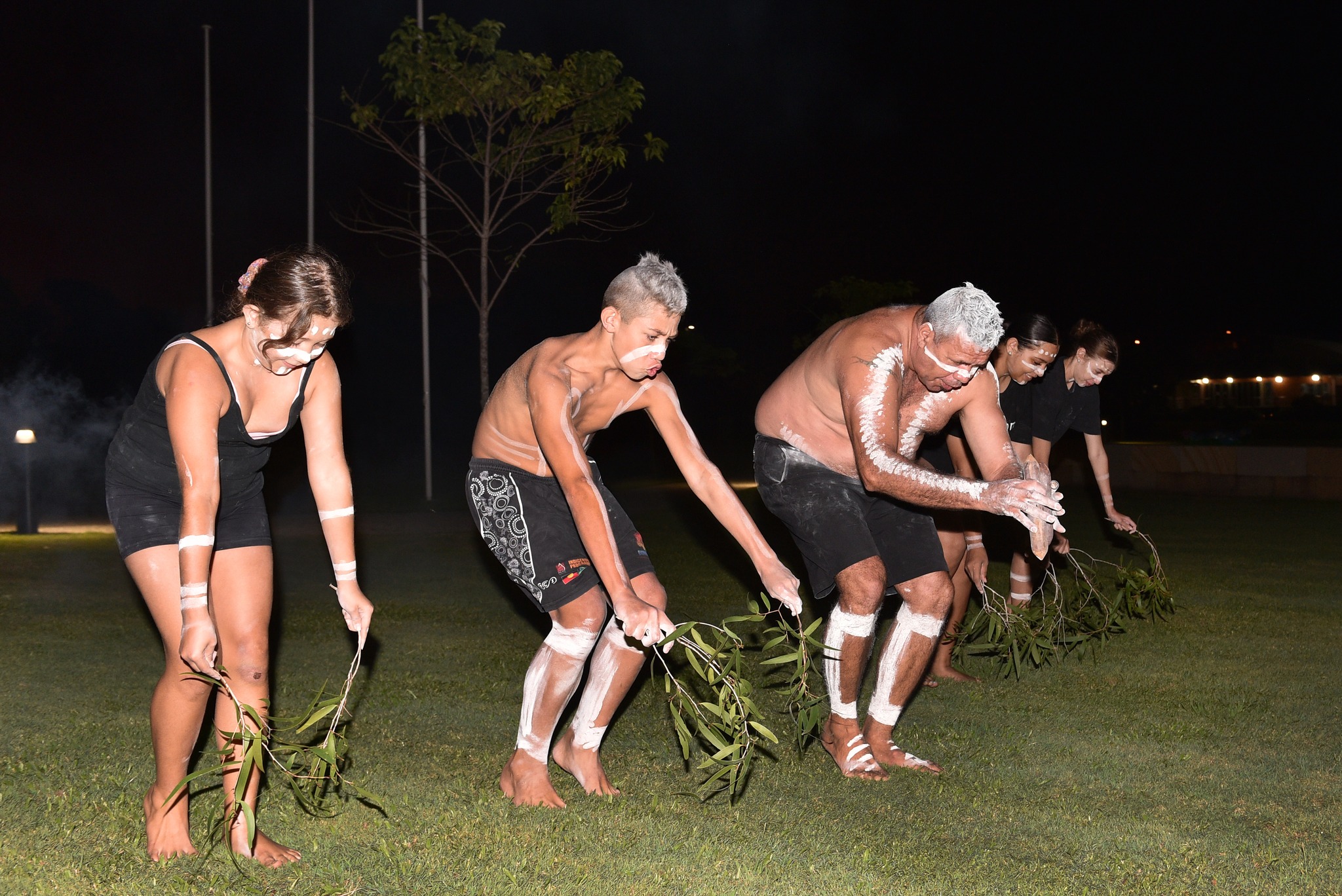 Butchulla man Narvo and members of the Owens Clan perform a ceremonial dance. Photo: Alistair Brightman