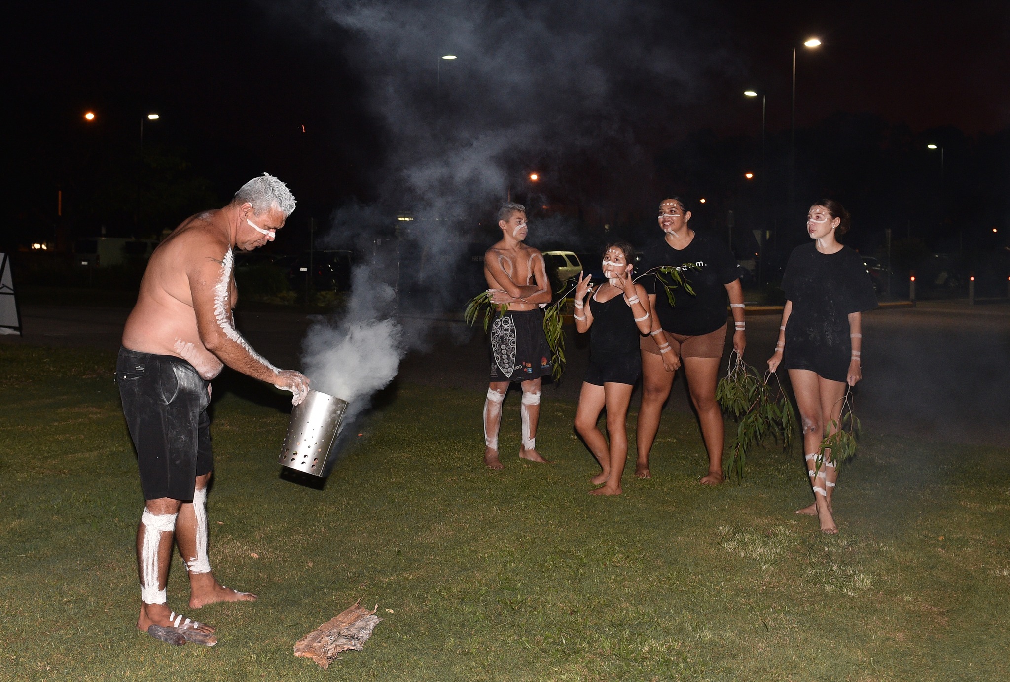 Butchulla man Narvo and members of the Owens Clan perform a smoking ceremony. Photo: Alistair Brightman