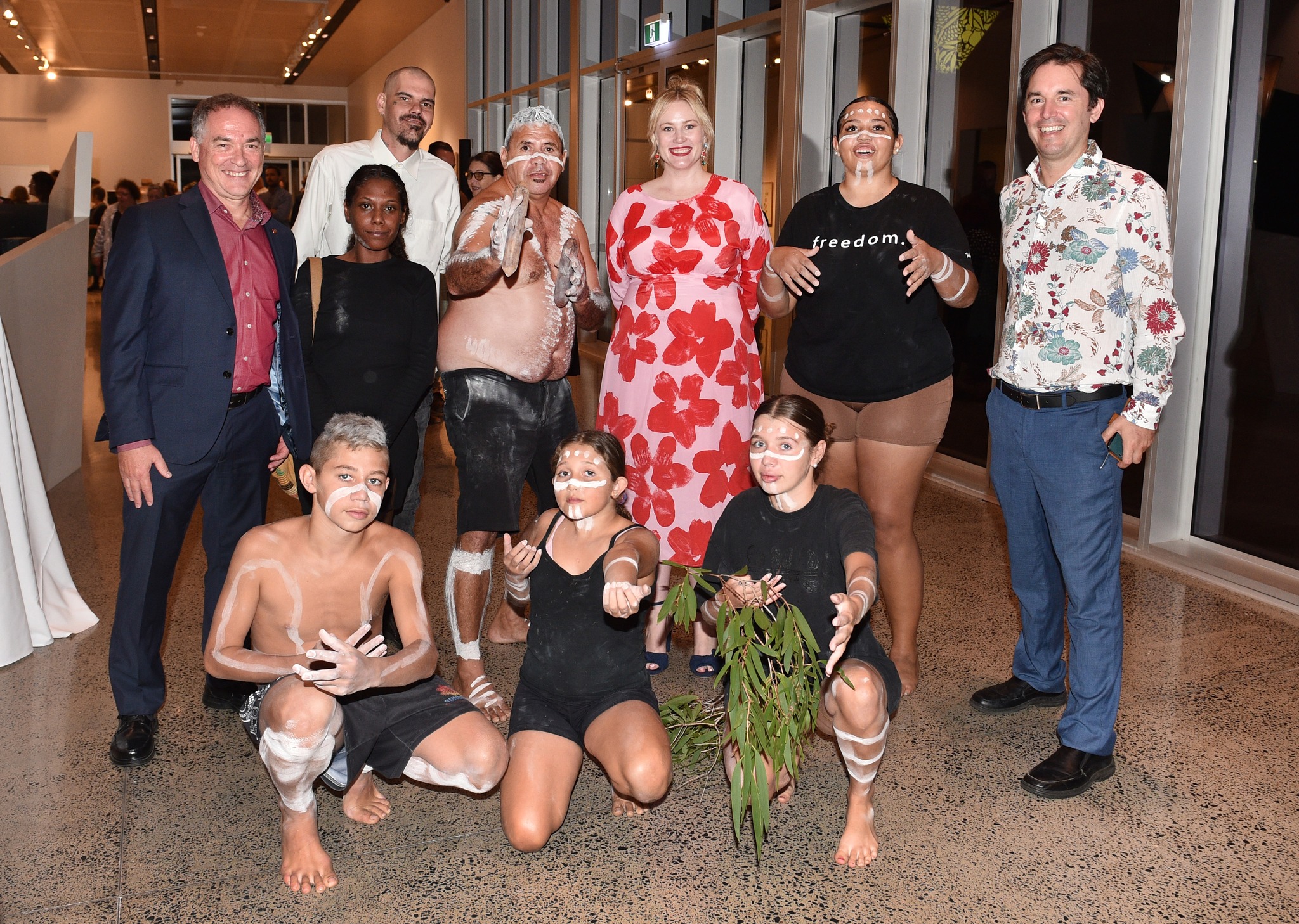 Gallery Director Ashleigh Whatling, Mayor George Seywmou, and State MP for Hervey Bay Adrian Tantari pose with memebers of the Owens Clan. Photo: Alistair Brightman