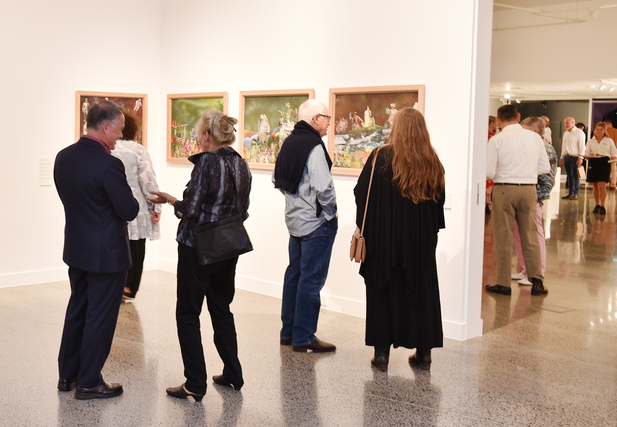 Gallery visitors take in opening exhibition Wildflowering by Design. Photo: Alistair Brightman