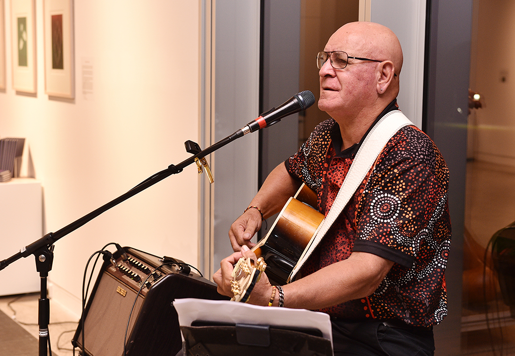 Local musician Jon Vea Vea performs at the HBRG exhibition opening night.